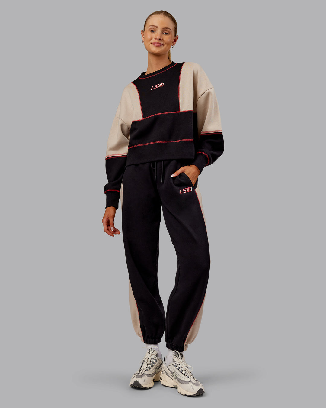 Woman wearing Stitch Up Oversized Fleece Sweater - Black-Shale Beige | Model:Ella | Size:S