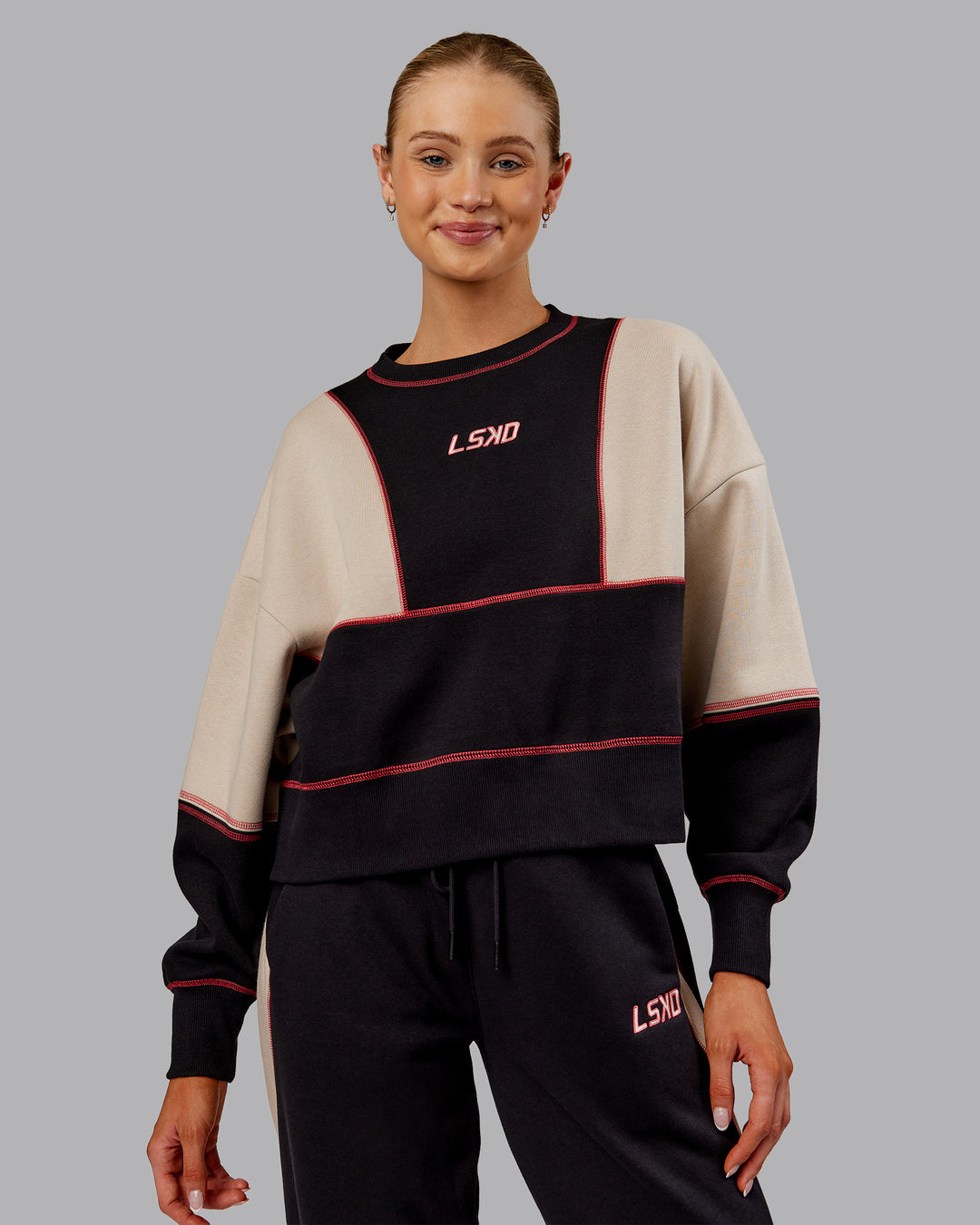 Woman wearing Stitch Up Oversized Fleece Sweater - Black-Shale Beige | Model:Ella | Size:S
