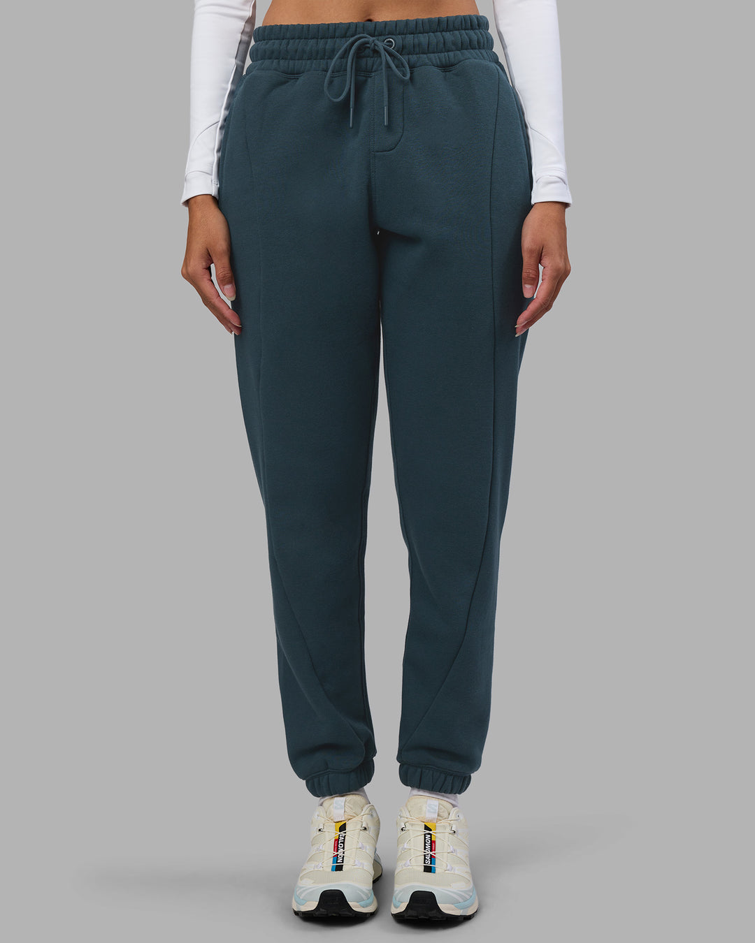 Woman wearing Stream Panel Track Pants - Deep Sea | Model:Rhiley | Size:S
