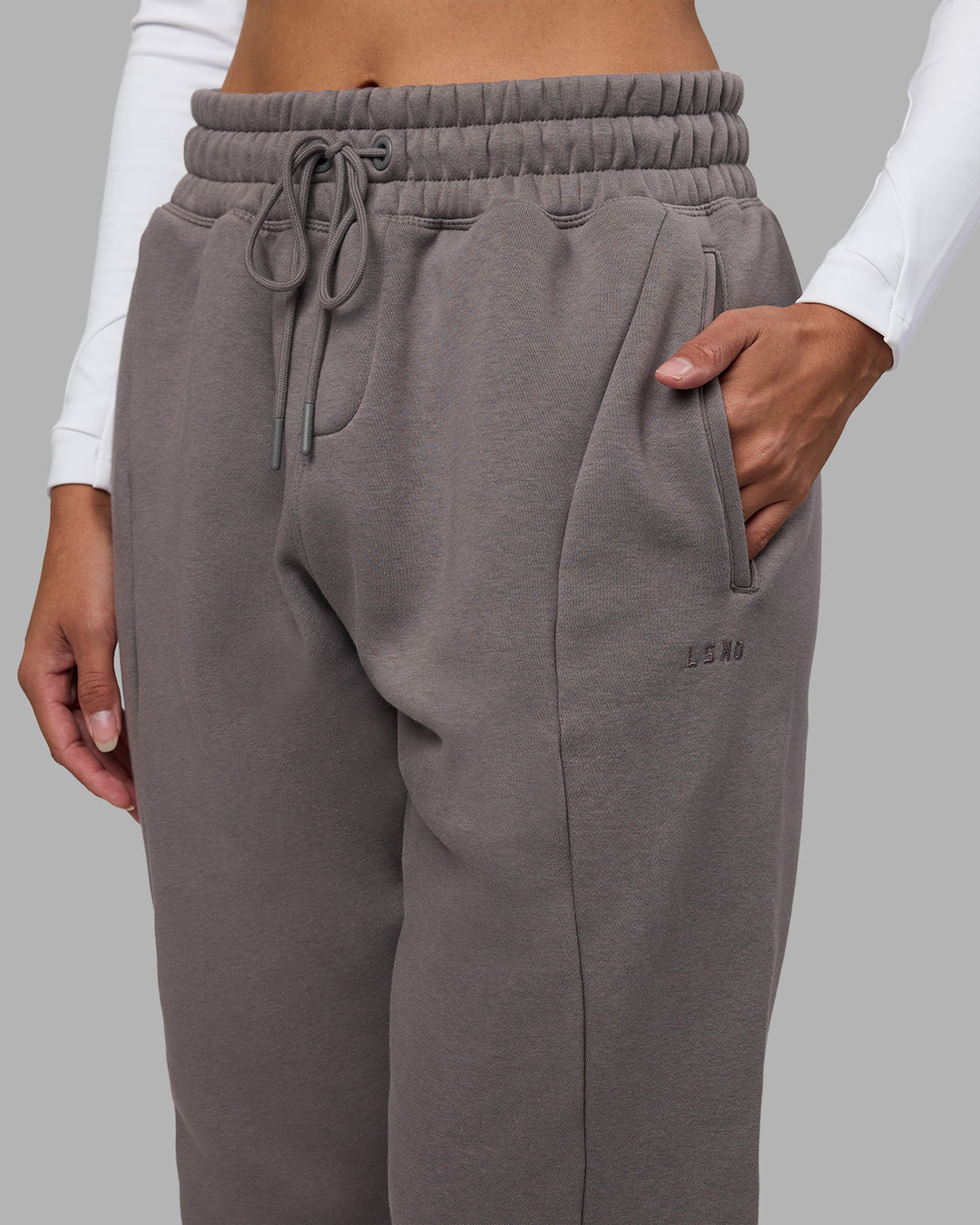 Woman wearing Stream Panel Track Pants - Storm Front | Model:Rhiley | Size:S