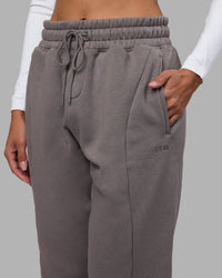 Woman wearing Stream Panel Track Pants - Storm Front | Model:Rhiley | Size:S