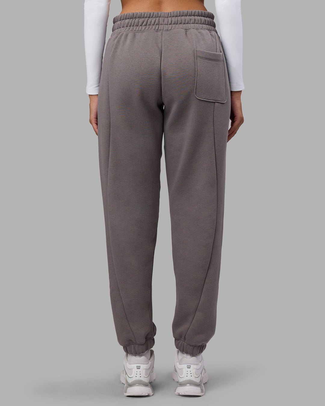 Woman wearing Stream Panel Track Pants - Storm Front | Model:Rhiley | Size:S