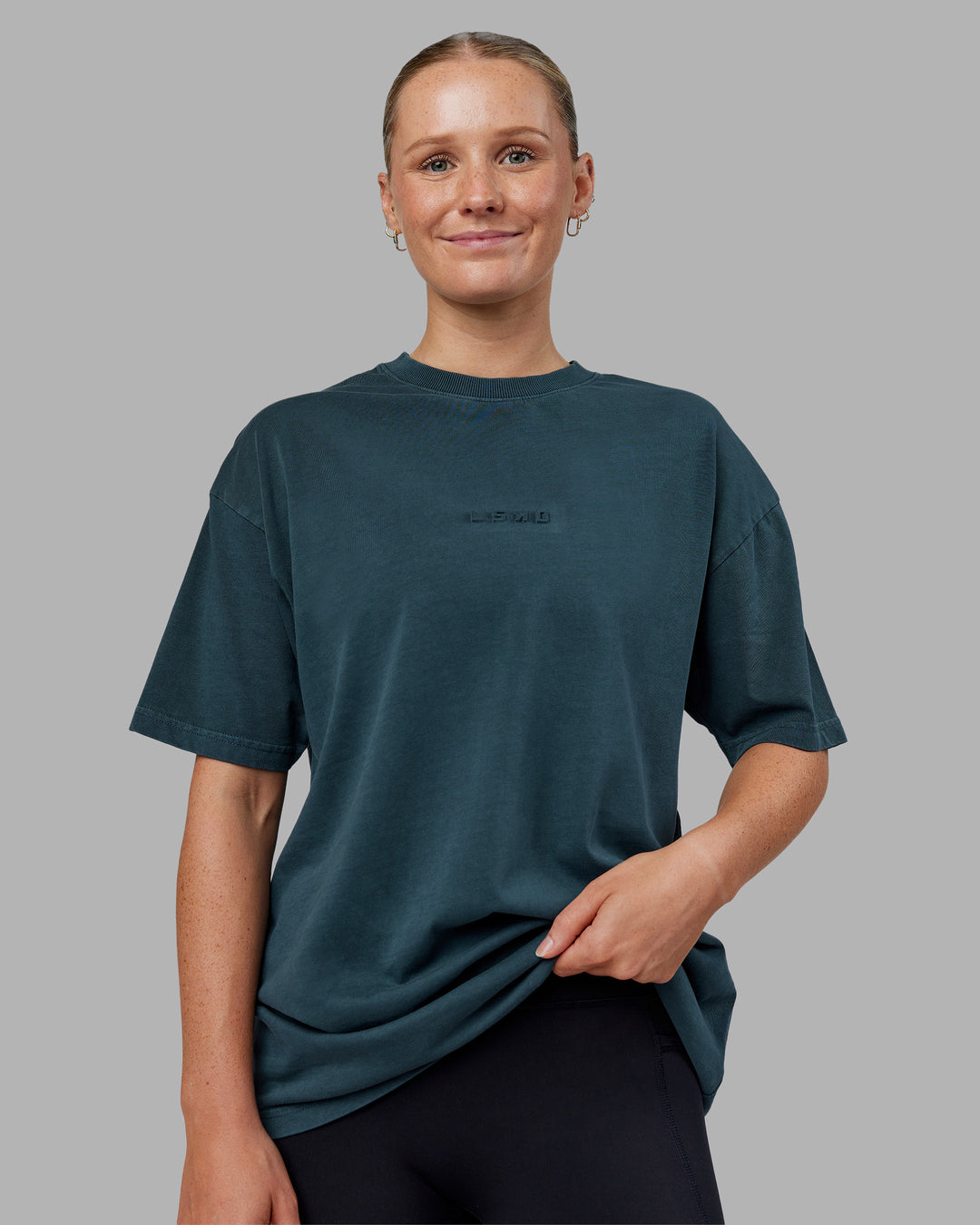 Woman wearing Stream Washed Heavyweight Oversized Tee - Washed Deep Sea | Model:Neve | Size:S