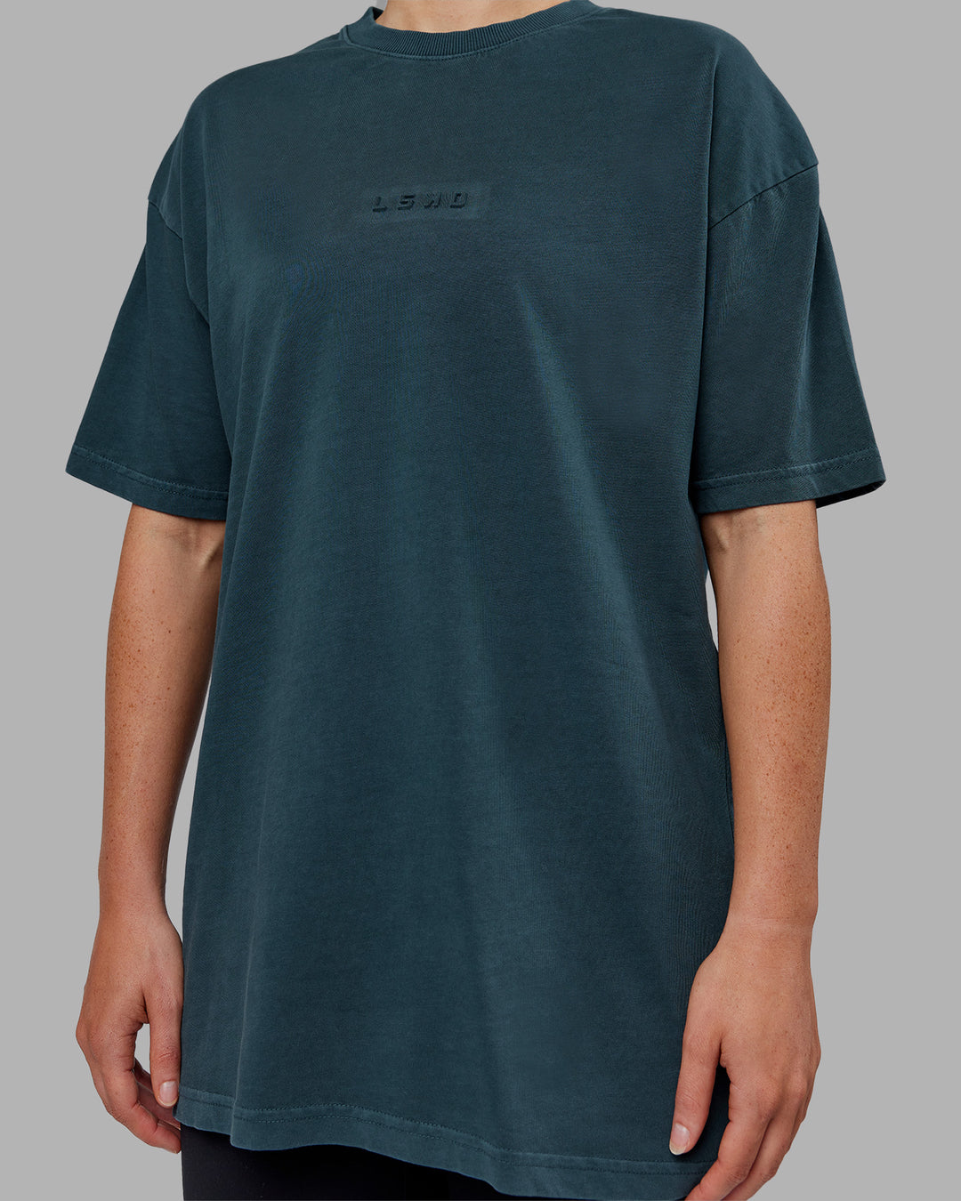 Woman wearing Stream Washed Heavyweight Oversized Tee - Washed Deep Sea | Model:Neve | Size:S