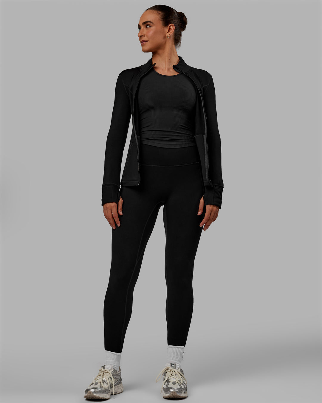 Woman wearing Stride Zip Through Thermal Jacket - Black