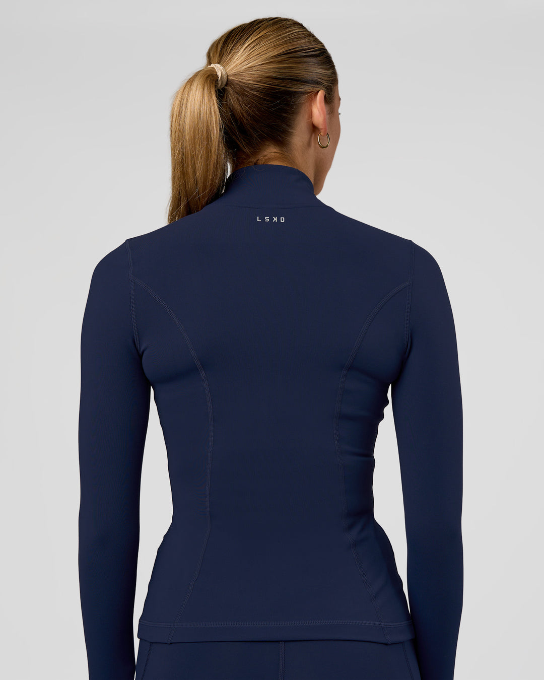 Woman wearing Stride Zip Through Jacket - Future Navy | Model:Evie | Size:S