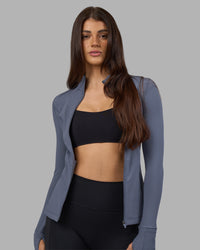 Woman wearing Stride Zip Through Jacket - Night Shadow | Model:Phoebe | Size:S