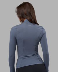 Woman wearing Stride Zip Through Jacket - Night Shadow | Model:Phoebe | Size:S