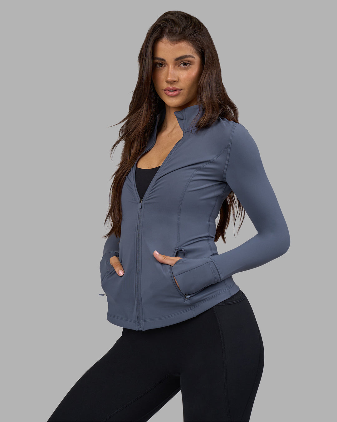 Woman wearing Stride Zip Through Jacket - Night Shadow | Model:Phoebe | Size:S
