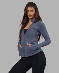 Woman wearing Stride Zip Through Jacket - Night Shadow | Model:Phoebe | Size:S