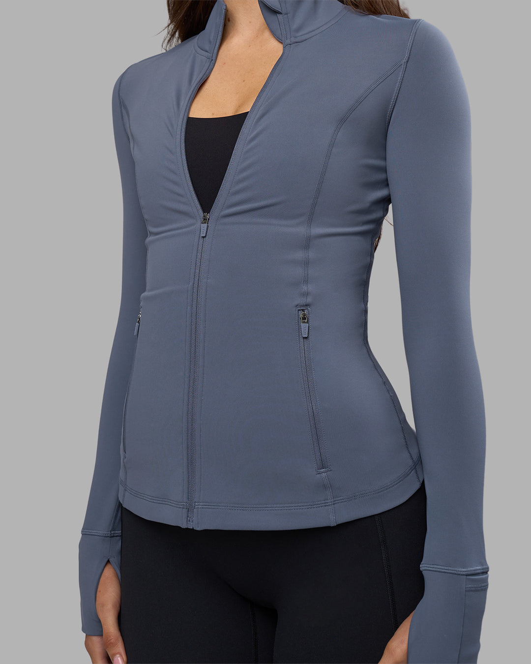 Woman wearing Stride Zip Through Jacket - Night Shadow | Model:Phoebe | Size:S
