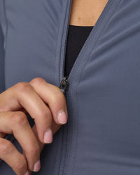 Woman wearing Stride Zip Through Jacket - Night Shadow | Model:Phoebe | Size:S