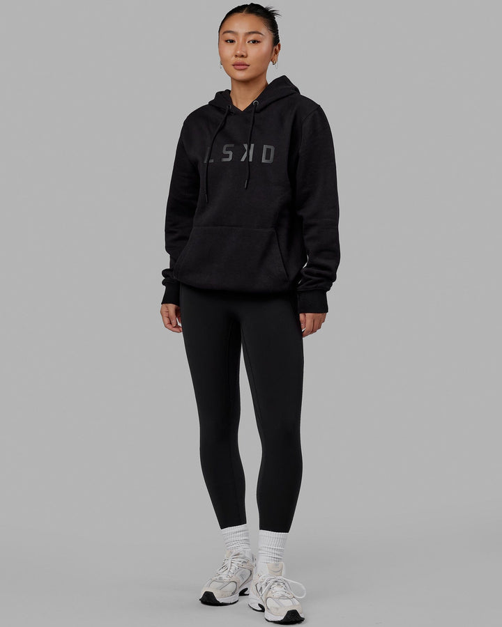 Woman wearing Unisex Structure Hoodie - Black-Black