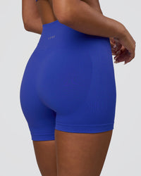 Woman wearing Surge Seamless High-Rise 4" Short - Power Cobalt | Model:Bianca | Size:S