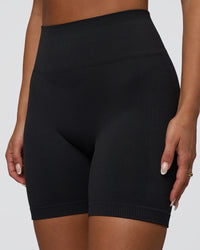 Woman wearing Surge Seamless High-Rise 6" Short - Black | Model:Bianca | Size:S