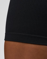 Woman wearing Surge Seamless High-Rise 6" Short - Black | Model:Bianca | Size:S