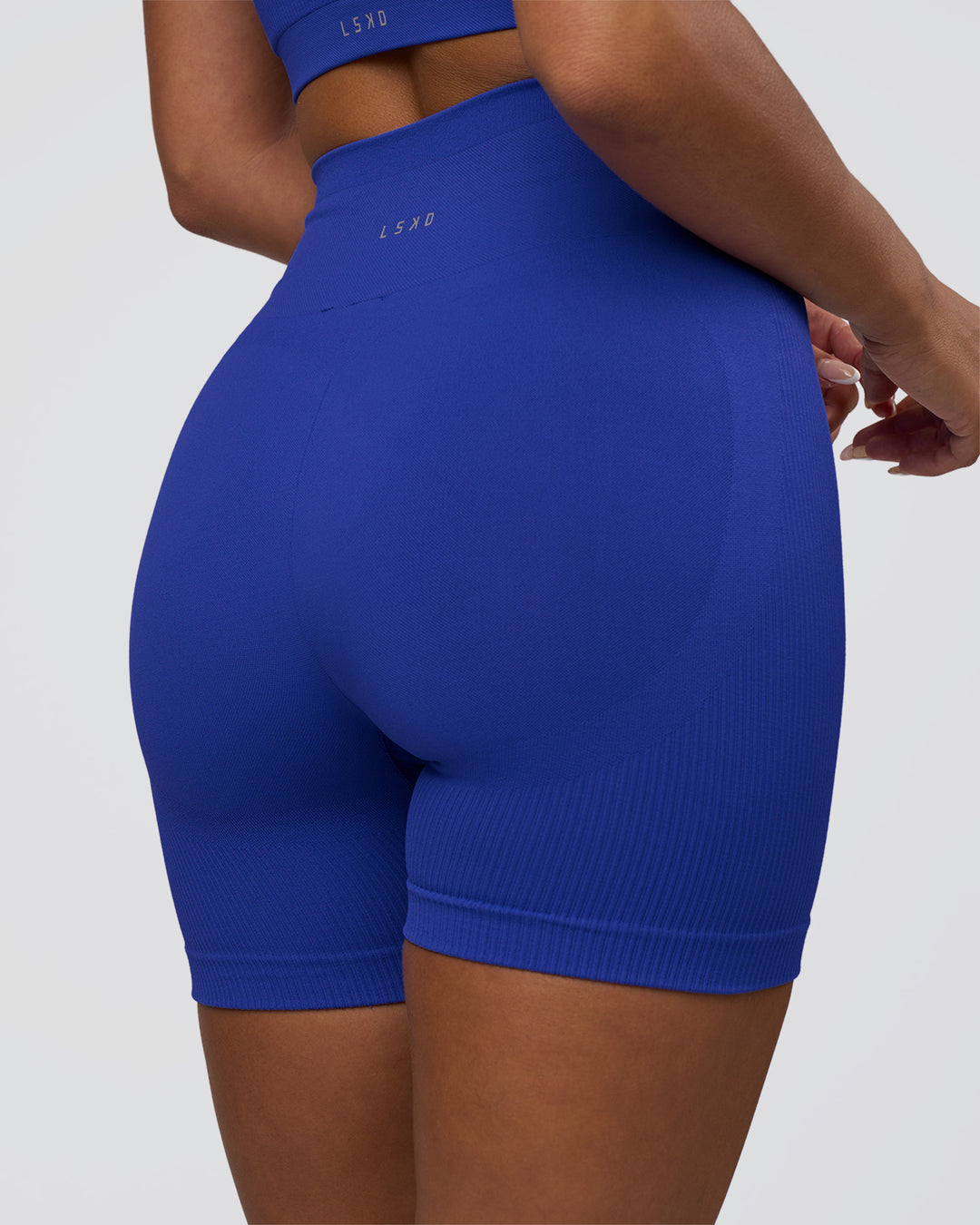 Woman wearing Surge Seamless High-Rise 6" Short - Power Cobalt | Model:Bianca | Size:S