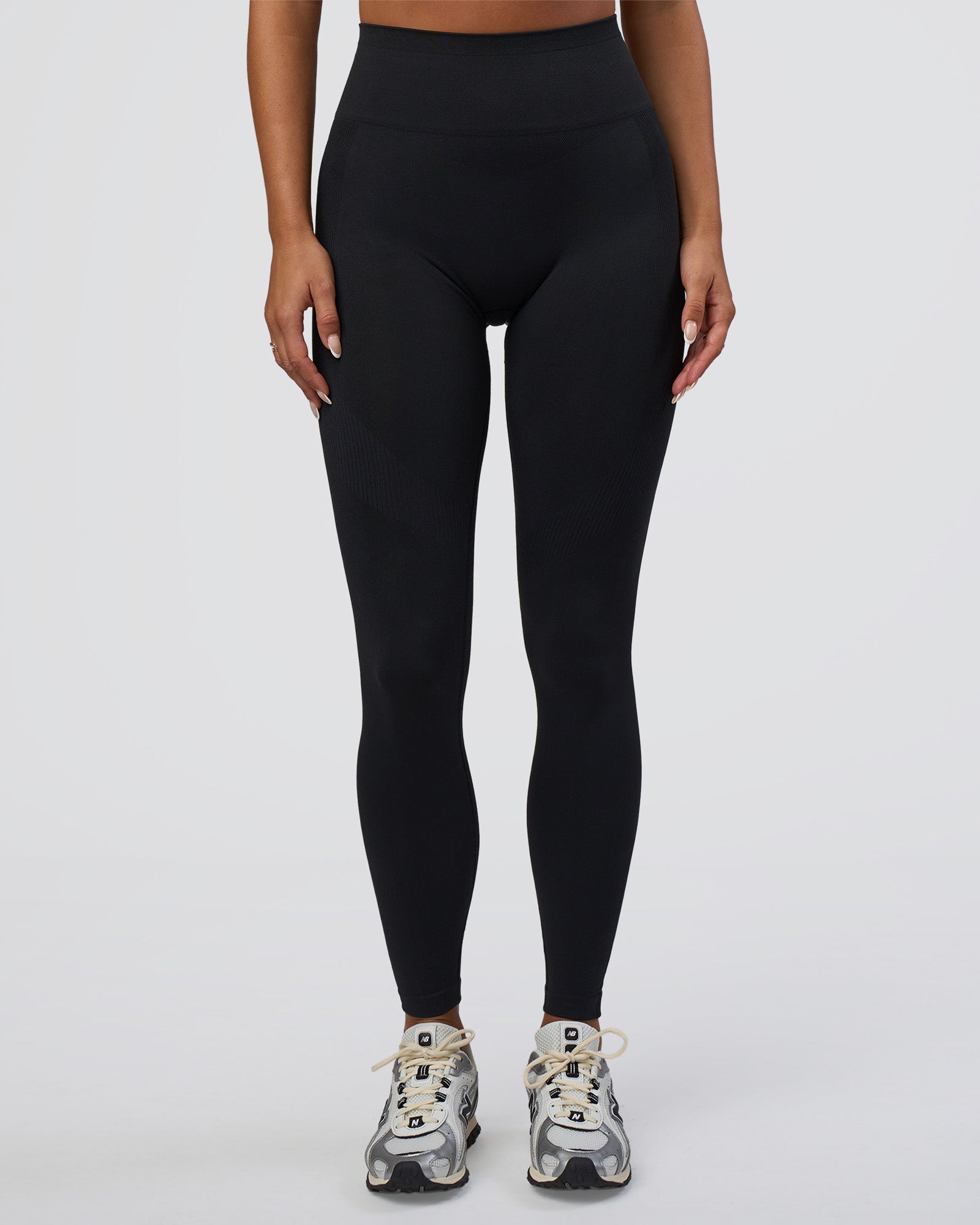 Woman wearing Surge Seamless High-Rise Full Length Legging - Black | Model:Bianca | Size:S