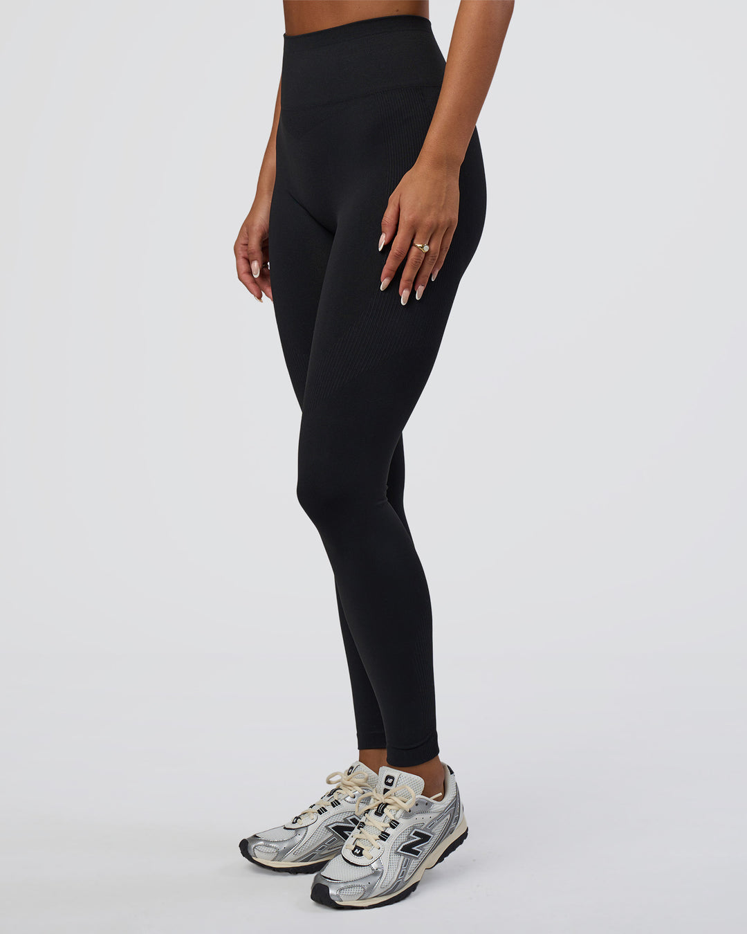 Woman wearing Surge Seamless High-Rise Full Length Legging - Black | Model:Bianca | Size:S