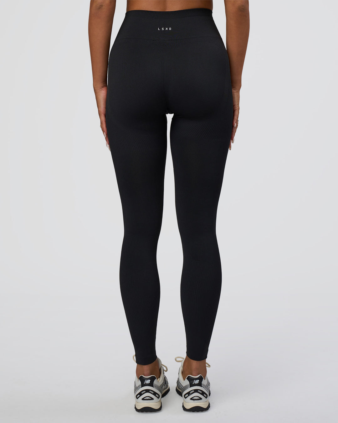 Woman wearing Surge Seamless High-Rise Full Length Legging - Black | Model:Bianca | Size:S