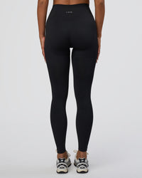 Woman wearing Surge Seamless High-Rise Full Length Legging - Black | Model:Bianca | Size:S