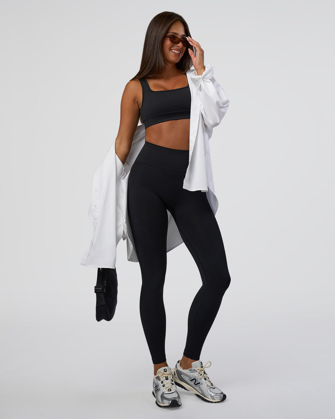 Woman wearing Surge Seamless High-Rise Full Length Legging - Black | Model:Bianca | Size:S
