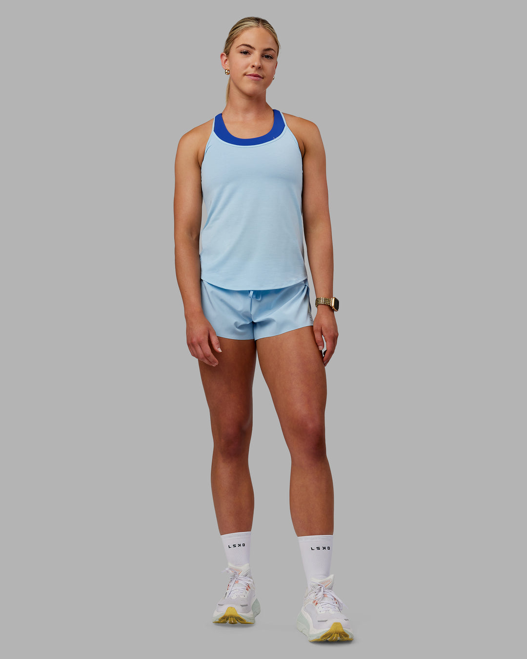 Woman wearing Swift Active Tank - Glacial Blue