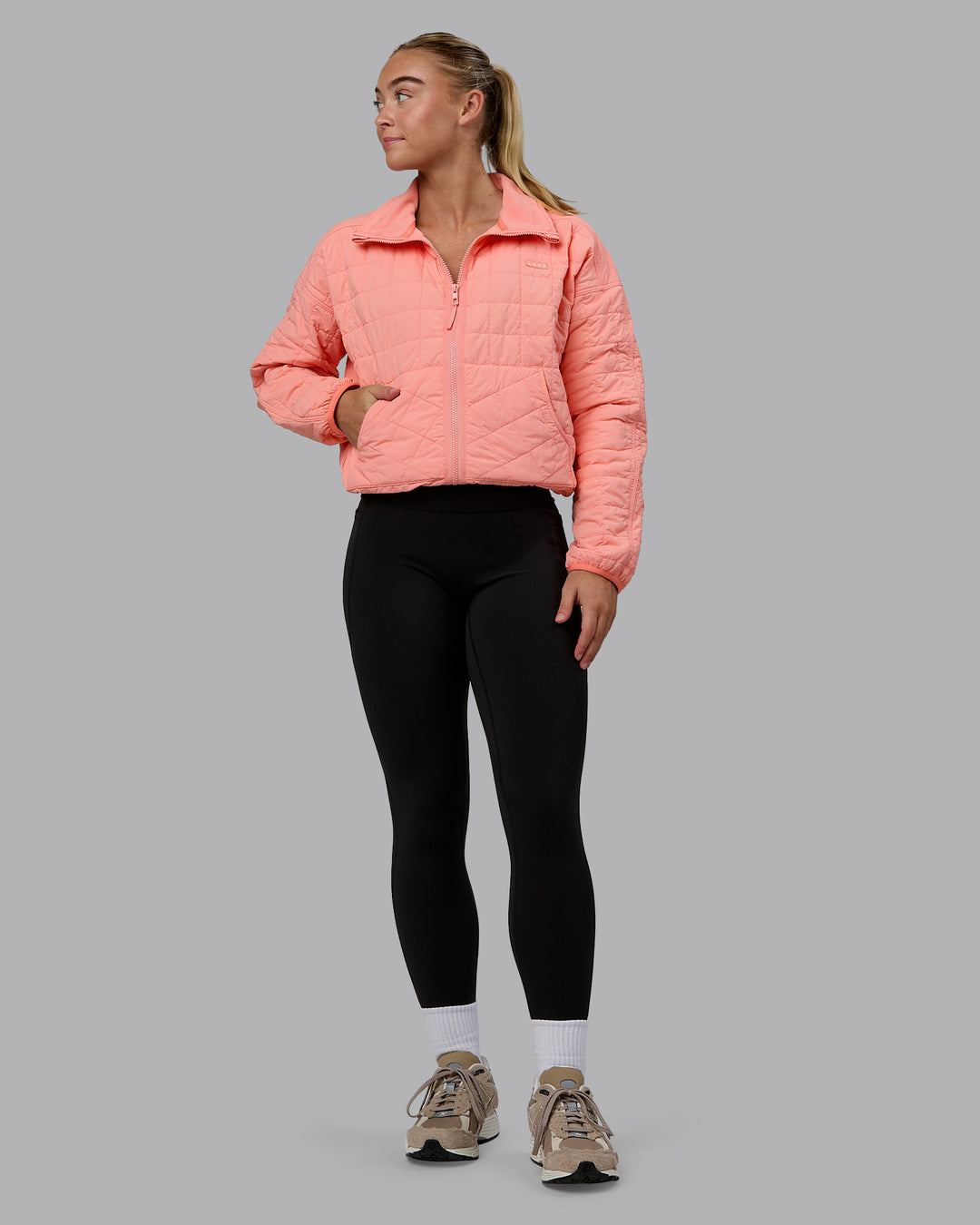 Woman wearing Thrive Packable Jacket - Murex Shell