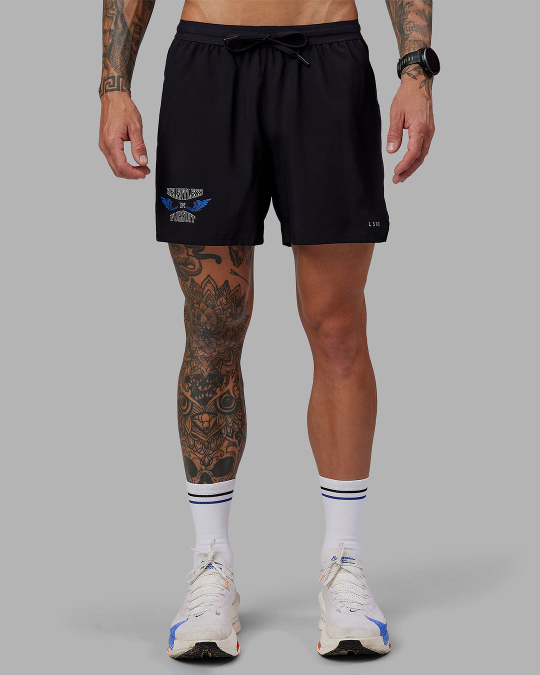 Man wearing Tommy Newell Pace 5&quot; Lined Performance Short - Black | Model:Tommy | Size:S