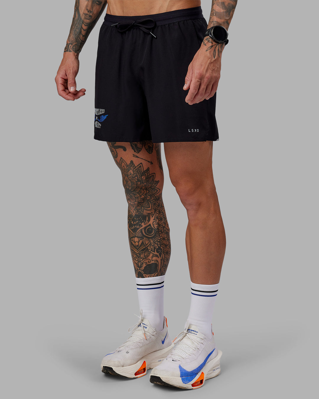Man wearing Tommy Newell Pace 5&quot; Lined Performance Short - Black | Model:Tommy | Size:S