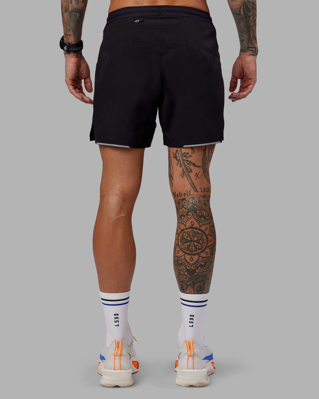Man wearing Tommy Newell Pace 5&quot; Lined Performance Short - Black | Model:Tommy | Size:S