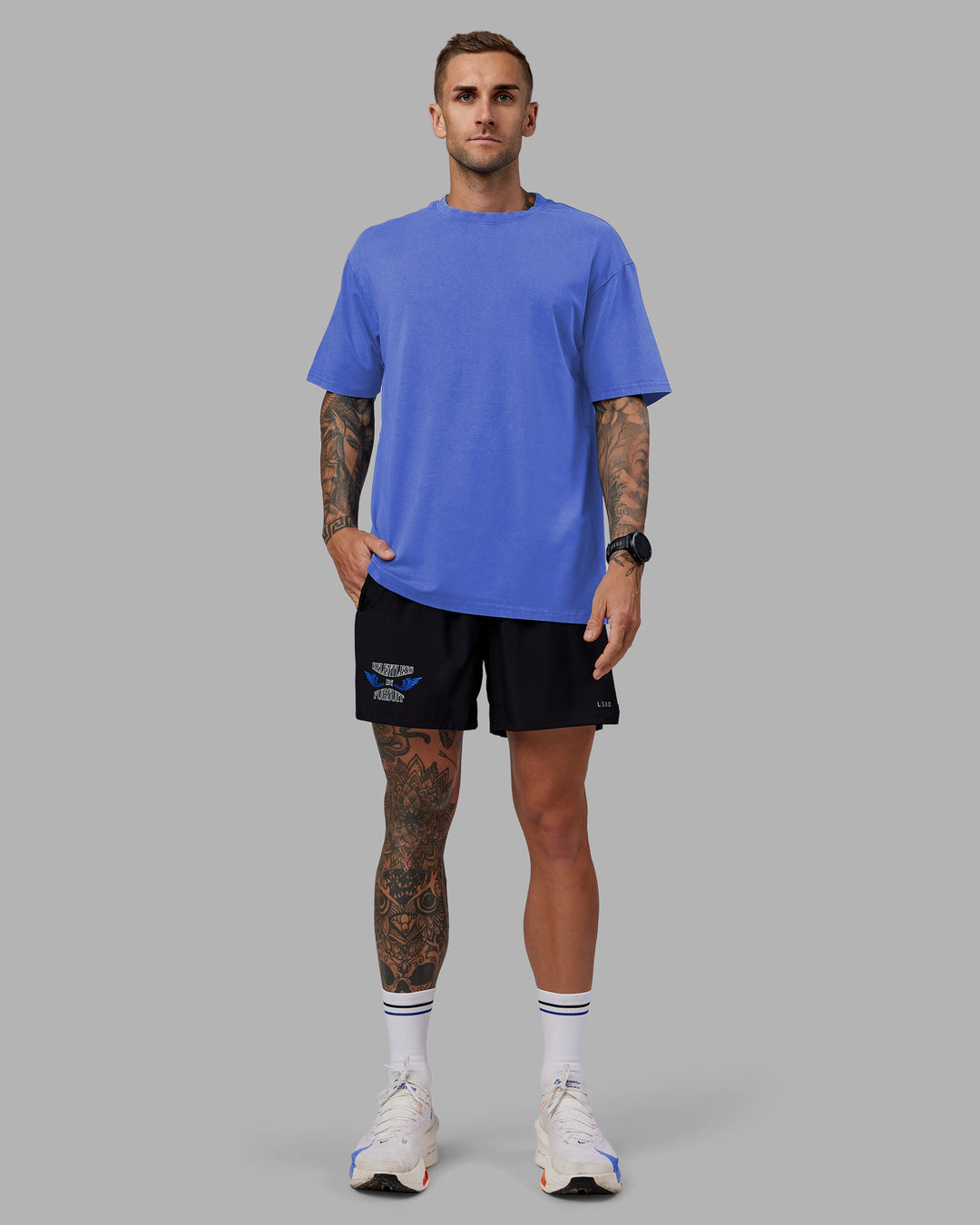 Man wearing Tommy Newell Pace 5&quot; Lined Performance Short - Black | Model:Tommy | Size:S