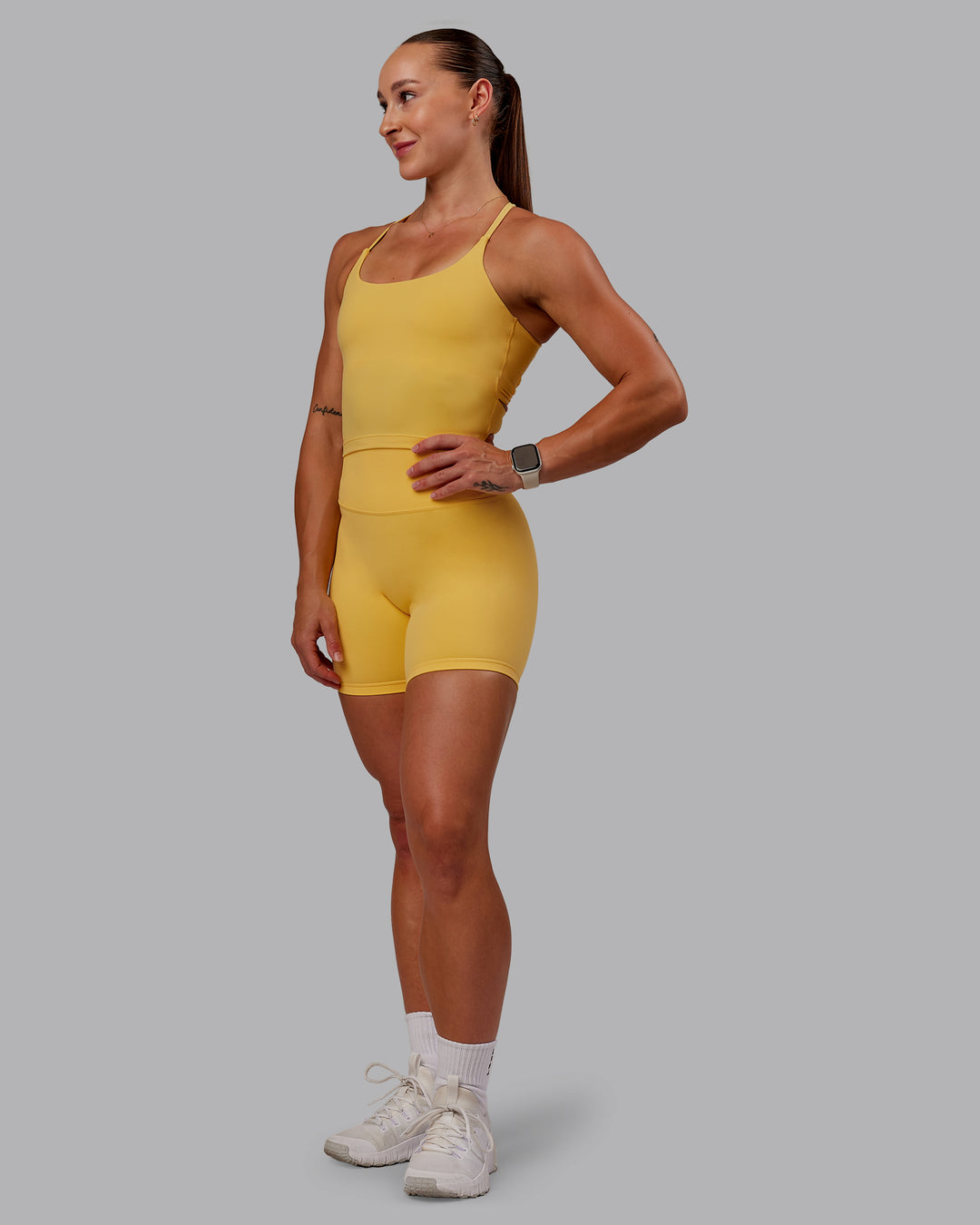 Woman wearing Twist Tank With Shelf Bra in Banana Cream | Size:S