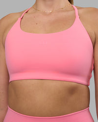 Woman wearing Twist Sports Bra - Candy Pink | Model:Phoebe | Size:S