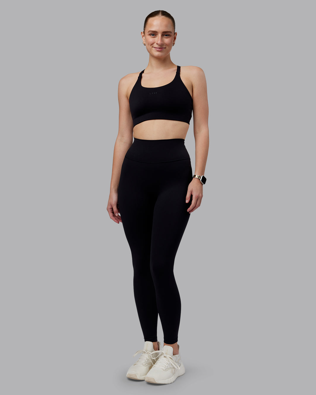 Woman wearing Twist Sports Bra D/DD/E - Black | Model:Lillie | Size:S