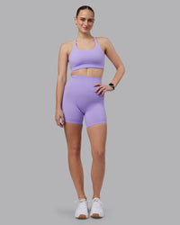 Woman wearing Twist Sports Bra D/DD/E - Violet Ray | Model:Lillie | Size:S