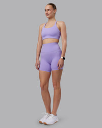 Woman wearing Twist Sports Bra D/DD/E - Violet Ray | Model:Lillie | Size:S