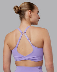Woman wearing Twist Sports Bra D/DD/E - Violet Ray | Model:Lillie | Size:S
