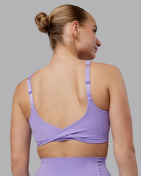Woman wearing Twist Sports Bra D/DD/E - Violet Ray | Model:Lillie | Size:S