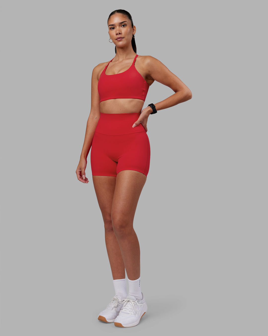 Woman wearing Twist Sports Bra - Scarlet | Model:Rhiley | Size:S