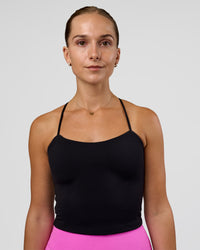 Woman wearing Twister Shelf Bra Tank - Black | Model:Myrte | Size:S