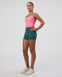 Woman wearing Twister Shelf Bra Tank - Candy Pink | Model:Myrte | Size:S