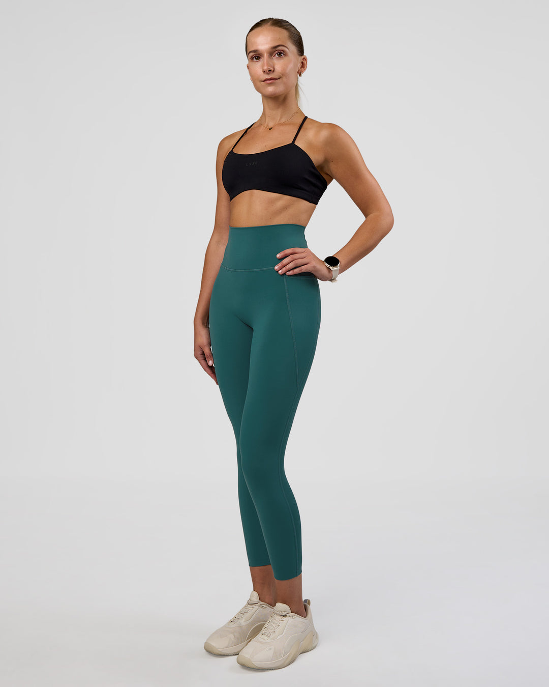 Woman wearing Twister Sports Bra - Black  | Model:Myrte | Size:S