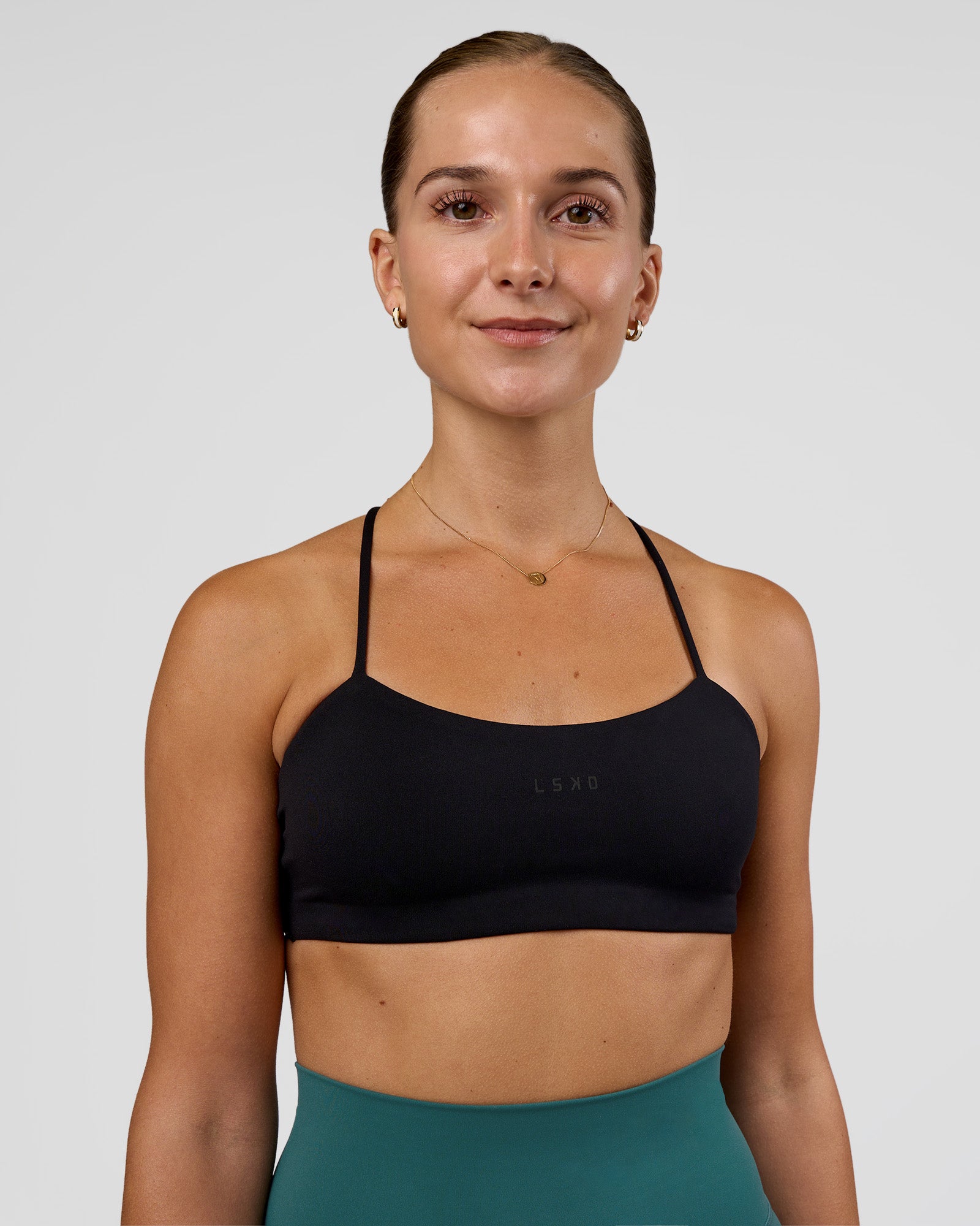Woman wearing Twister Sports Bra - Black  | Model:Myrte | Size:S