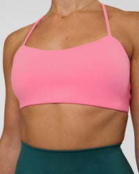 Woman wearing Twister Sports Bra - Candy Pink | Model:Myrte | Size:S