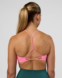Woman wearing Twister Sports Bra - Candy Pink | Model:Myrte | Size:S
