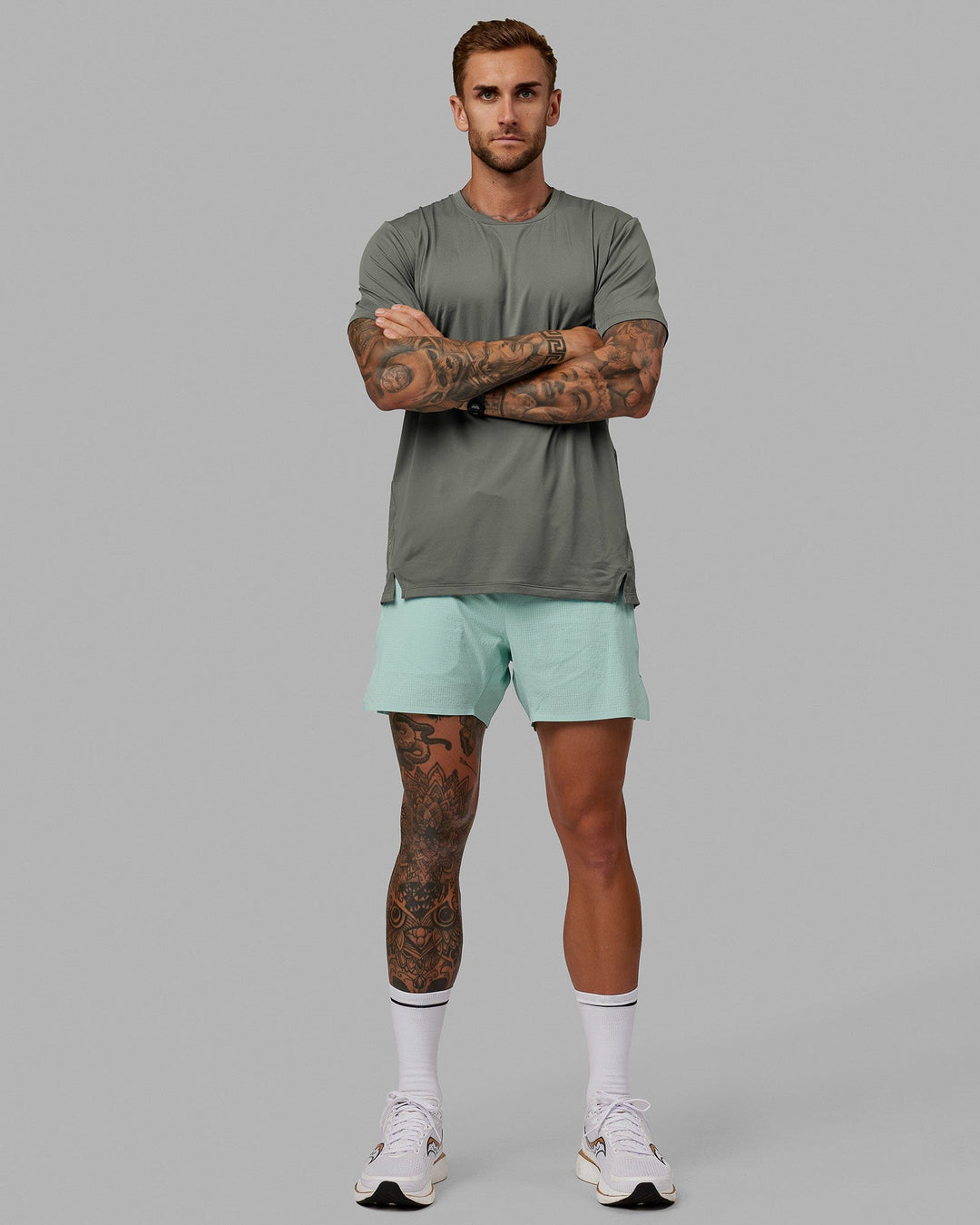 Man wearing UltraAir 5&quot; Lined Performance Short - Pastel Turquoise-Reflective