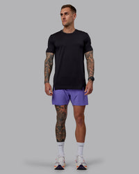Man wearing UltraAir 5" Lined Performance Shorts - Dahlia Purple