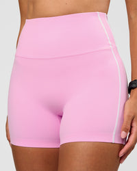 Woman wearing Unbreakable Ultra High-Rise 4" Short - Pink Rose-White | Model:Rhiley | Size:S