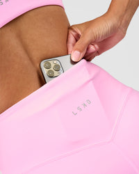 Woman wearing Unbreakable Ultra High-Rise 4" Short - Pink Rose-White | Model:Rhiley | Size:S